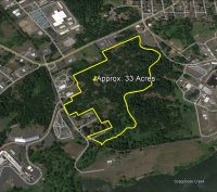 Map of property outlined in yellow with 33 acres