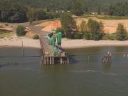 Shipping dock on the river, beach and trees