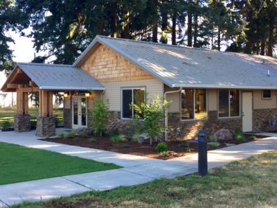 Exterior wood building with trees in background