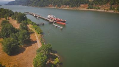 Ship anchored at dock on river