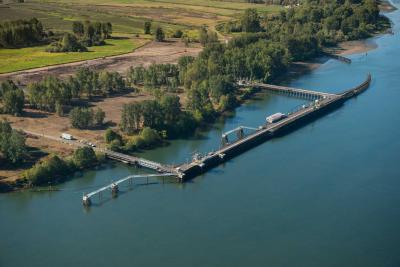Large shipping dock on river with trees on the shoreline